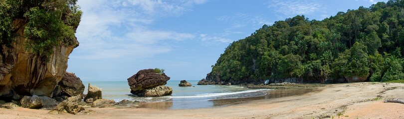 Fototapeta na wymiar Sandy beach (Telok Paku) with rocks in Bako National Park, Borneo, Sarawak, Malaysia