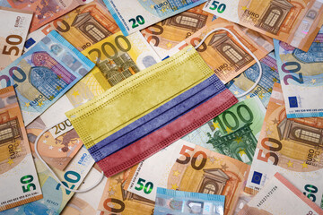 Medical mask with the flag of Colombia on a variety of european banknotes.(series)