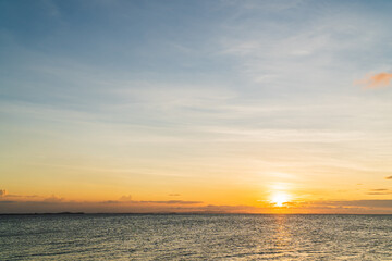 Fototapeta na wymiar Sunset sky over sea in the evening with colorful sunlight, Dusk sky.