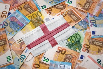 Medical mask with the flag of England on a variety of european banknotes.(series)
