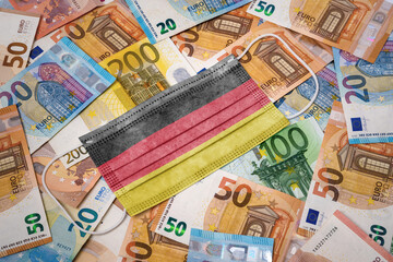 Medical mask with the flag of Germany on a variety of european banknotes.(series)
