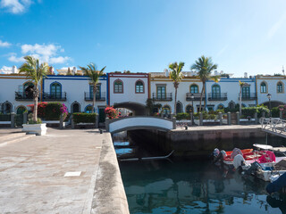 Colorful buildings of Puerto de Mogan with sea canals and boats. Traditional spanish colonial...