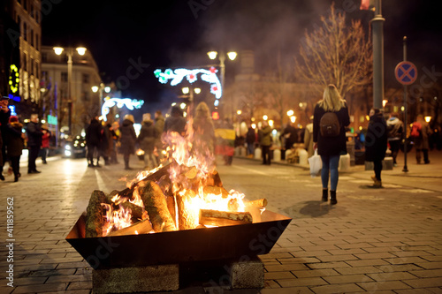 Bonfires lit on Gediminas avenue on the night on February 16 in Vilnius, Lithuania. People attending the celebration of Restoration of the State Day.