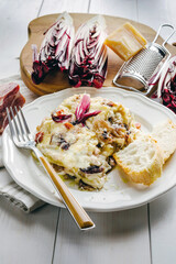 Homemade lasagna with Treviso radicchio, speck and bechamel sauce