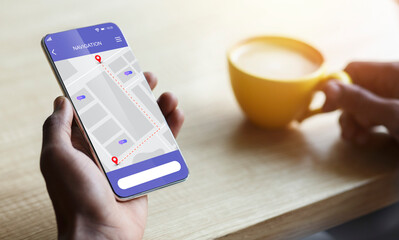 Closeup Of Smartphone With Mobile Navigation App In Male Hand