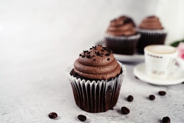 Chocolate cupcake served in on a  plate, selective focus