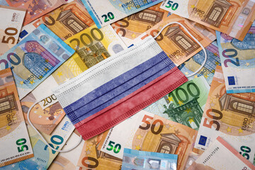Medical mask with the flag of Russia on a variety of european banknotes.(series)
