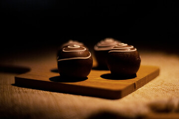 chocolate pieces on a wooden table