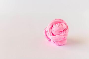 Rose made of solid plasticine on a light background. The concept of children's creativity.