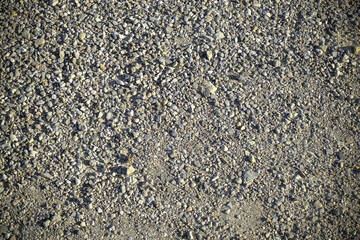Texture of gravel, grit, pebble surface top view. Industrial background. Copy space