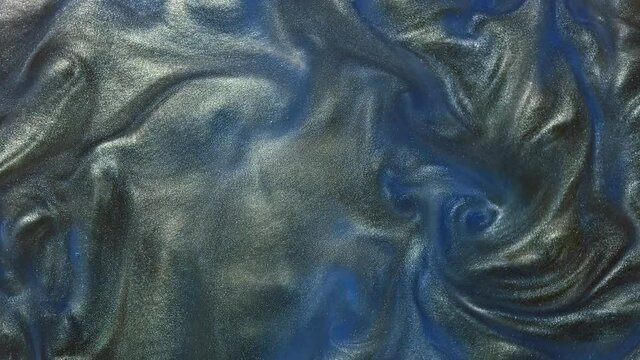Deep blue space cloud glitter metalic fluid liquid motion wallpaper background. Shine color grain paint. Texture abstract acrylic cloud swirling underwater.