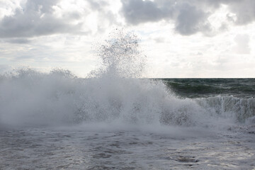 Fototapeta na wymiar Big splashes from the sea waves