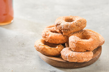 Homemade donuts sugar glazed on a stone background