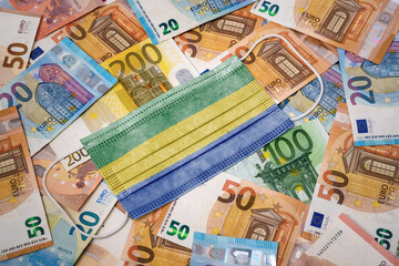 Medical mask with the flag of Gabon on a variety of european banknotes.(series)