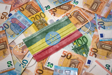 Medical mask with the flag of Ethiopia on a variety of european banknotes.(series)