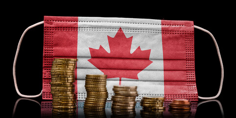 Medical mask with the flag of Canada behind some shrinking stacks of various coins.(series)