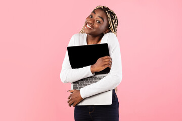 Technology Lover. Excite black woman hugging personal computer