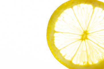 The lemon slice is transparent on a white background. Closeup