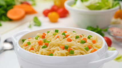 Instant noodles, served with vegetables and herbs