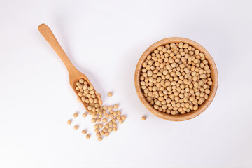 Soya bean in wooden bowl scoop spoon on white background