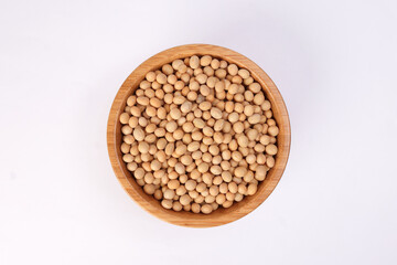 Soya bean in wooden bowl on white background