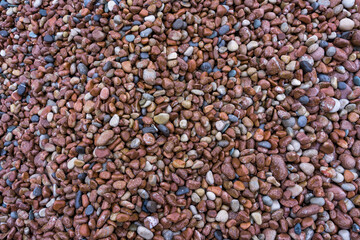 Brown and white pebbles on the beach as a natural background