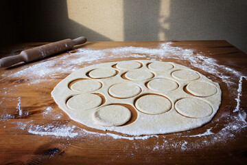 The process of making homemade dumplings with rustic cottage cheese on hard wheat dough, prepared by hand, is a great lunch dish