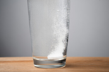 A tablet in a glass of water