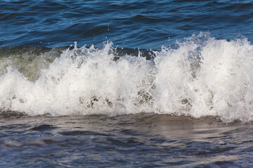 Breaking wave.Beautiful blue sea during the wind