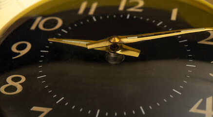 Nine in the morning closeup view on gold clock