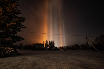 Light Pillars result from a rare meteorological phenomena. Winter nature landscape.
