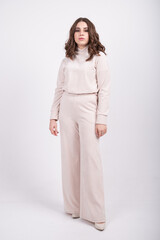 Full length view of young woman in jersey suit. The concept of casual comfortable women's clothing, basic wardrobe. Clothing made from natural materials, cotton.