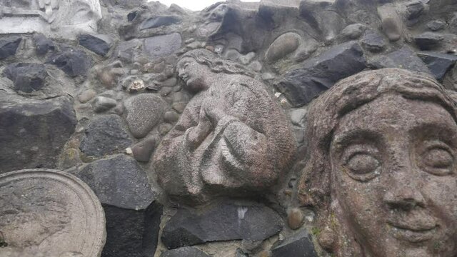 Old stone sculptures. Beautiful stone wall sculpture.