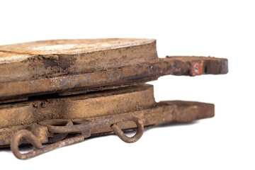 Old worn out brake pads from a car on a white background, isolate, close-up. Quality of friction linings, modern auto parts