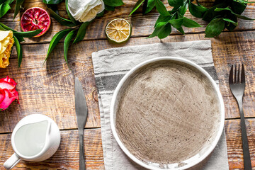 ceramic tableware top view on wooden background mock up
