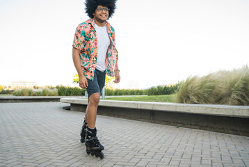 Latin man rollerskating on the street
