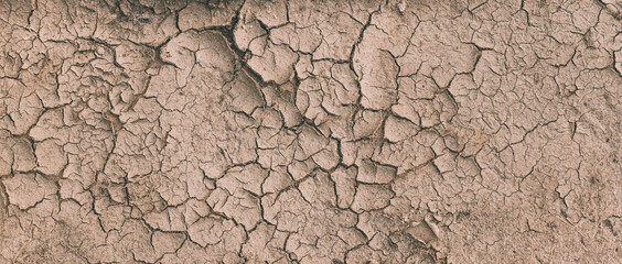 Background Of Brown Dry Cracked Soil Dirt Or Earth During Drought. Dry Cracked Earth Depicting...