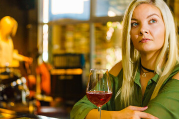 Girl with alcohol glass in pub club
