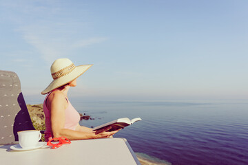 Fototapeta na wymiar Woman on sea read book, relaxing