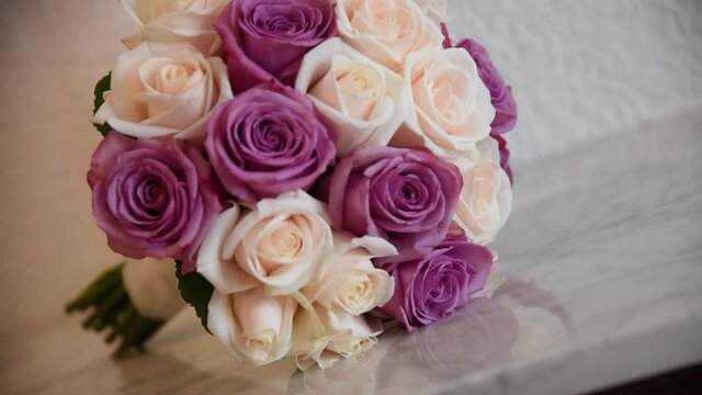 A bouquet of white and pink cor roses. Accessories for the bride on her wedding day