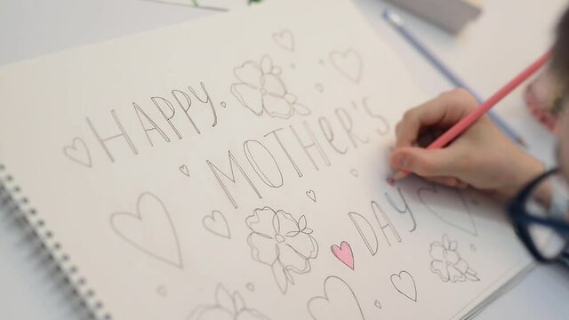 Greeting card Mother's Day. Children's drawing postcard. Gift for mom. Child boy draws picture