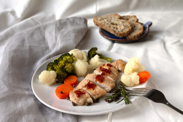 A nutritious dish for a full dinner of steamed turkey and steamed vegetables with tomato sauce