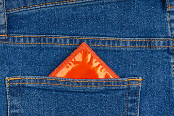 Condom pack in the blue jeans back pocket