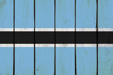 Botswana national flag on wooden texture