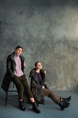 Naklejka premium two girls in a gray sweater