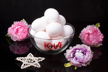 colorful easter eggs in a bowl on a black background. Easter Day