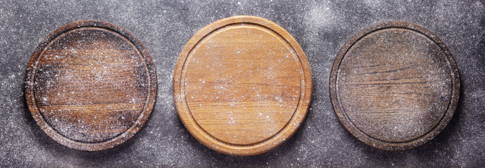 Scatterd flour powder food and pizza cutting board as bakery concept for homemade bread baking