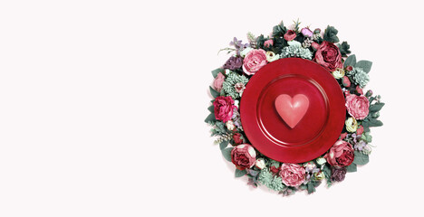 Happy Valentines day card bouquet decorated tray with heart in the middle on soft pink background. Festive floral decoration edgeless