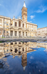 Fototapeta na wymiar Rome, Italy - in Winter time, frequent rain showers create pools in which the wonderful Old Town of Rome reflects like in a mirror. Here in particular Santa Maria Maggiore