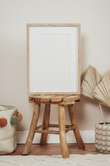 Wooden frames and canvases in children's boho interior 